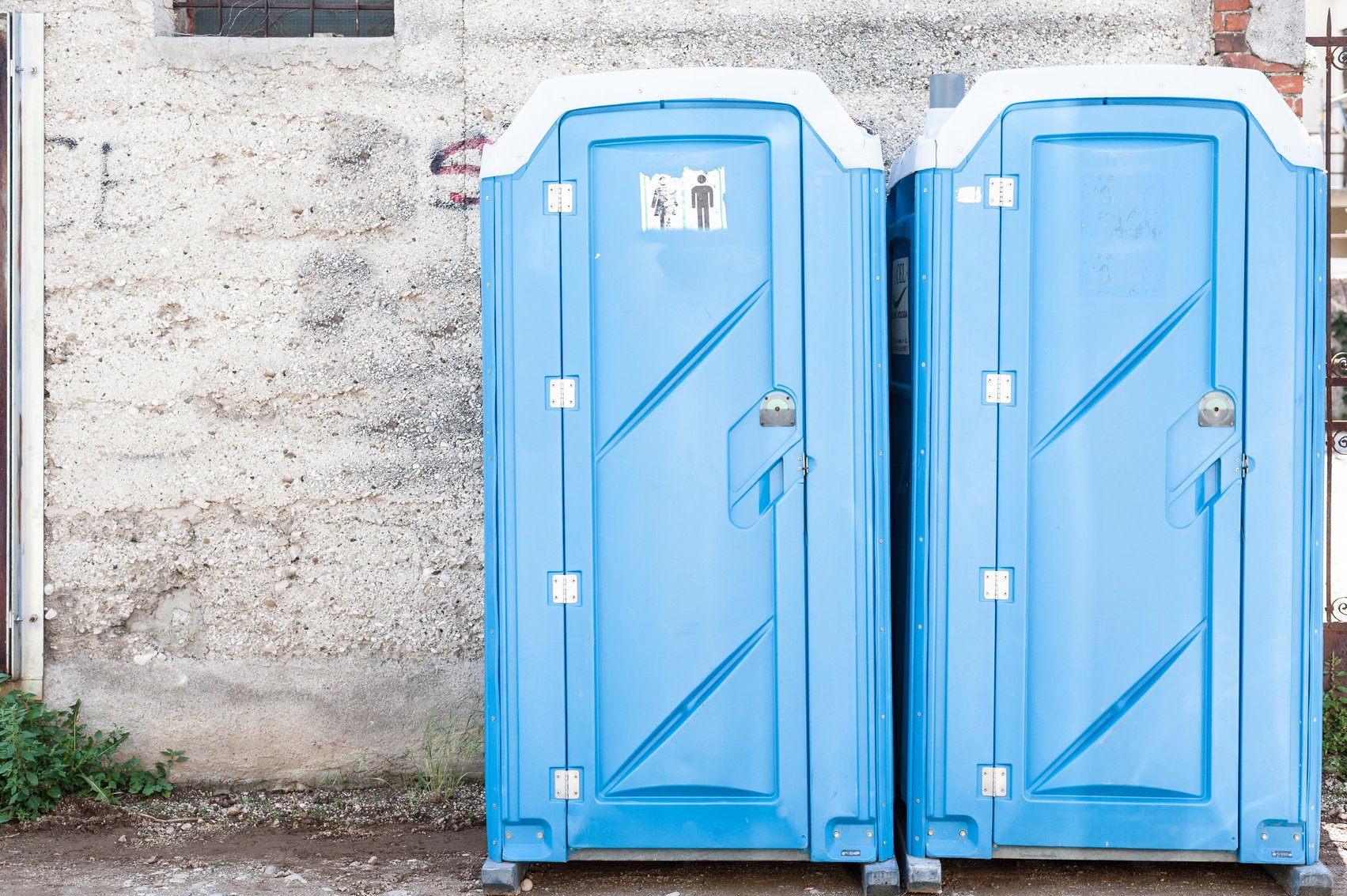 Two Blue Portable Toilet